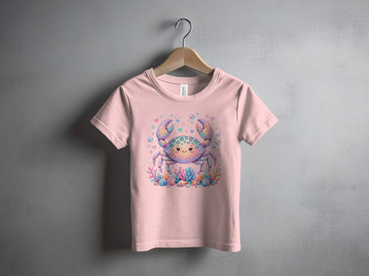 Pink t-shirt with a cartoon crab and coral illustration.