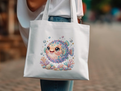 White tote bag with cartoon pufferfish and coral illustration.