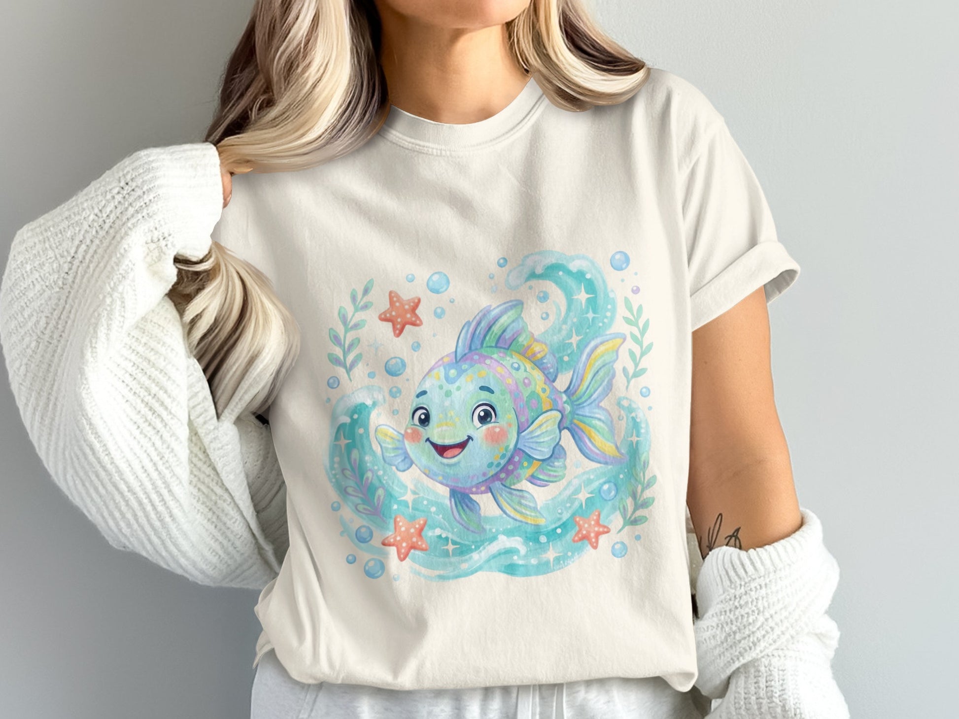Cute cartoon goldfish with bubbles and starfish on a white t-shirt.