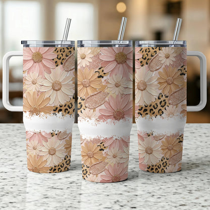 Floral and leopard print tumbler with white stripe and straw.