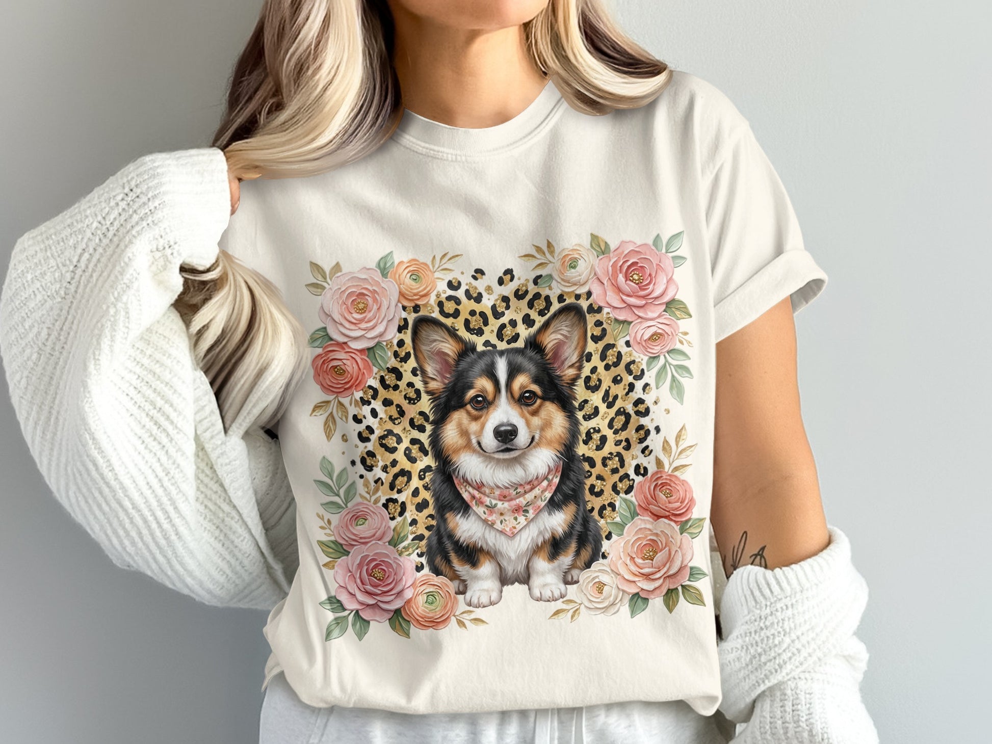 Cream t-shirt featuring a corgi wearing a bandana, surrounded by floral elements and leopard print.