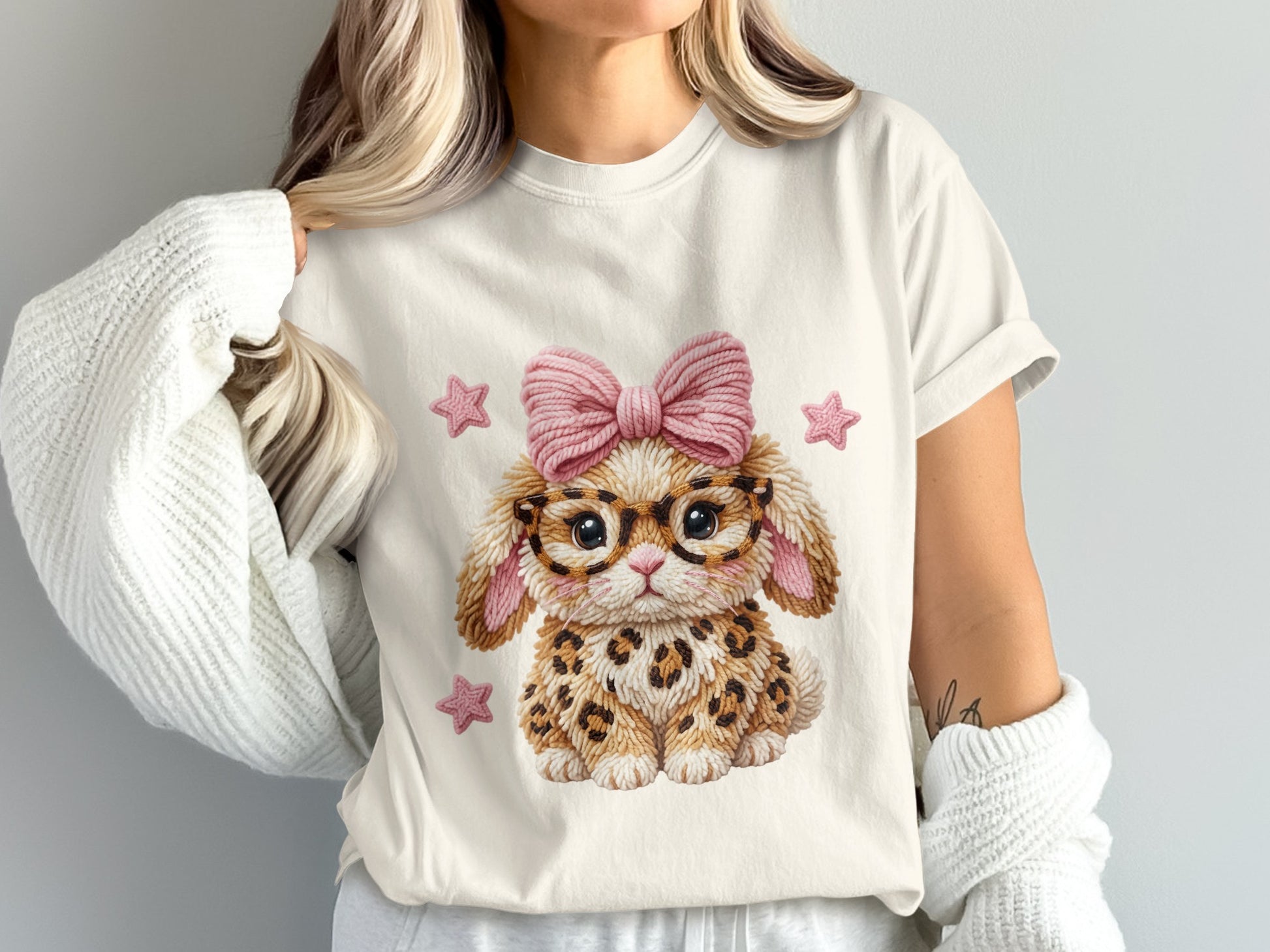 Cream t-shirt with leopard print bunny wearing glasses and a pink bow.