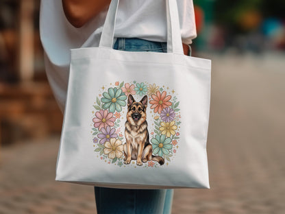 White tote bag with a German Shepherd surrounded by colorful flowers.