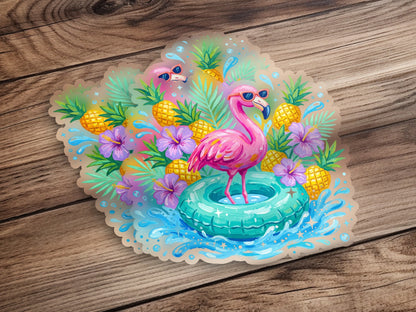 Pink flamingo in a pool float with pineapples and tropical flowers.