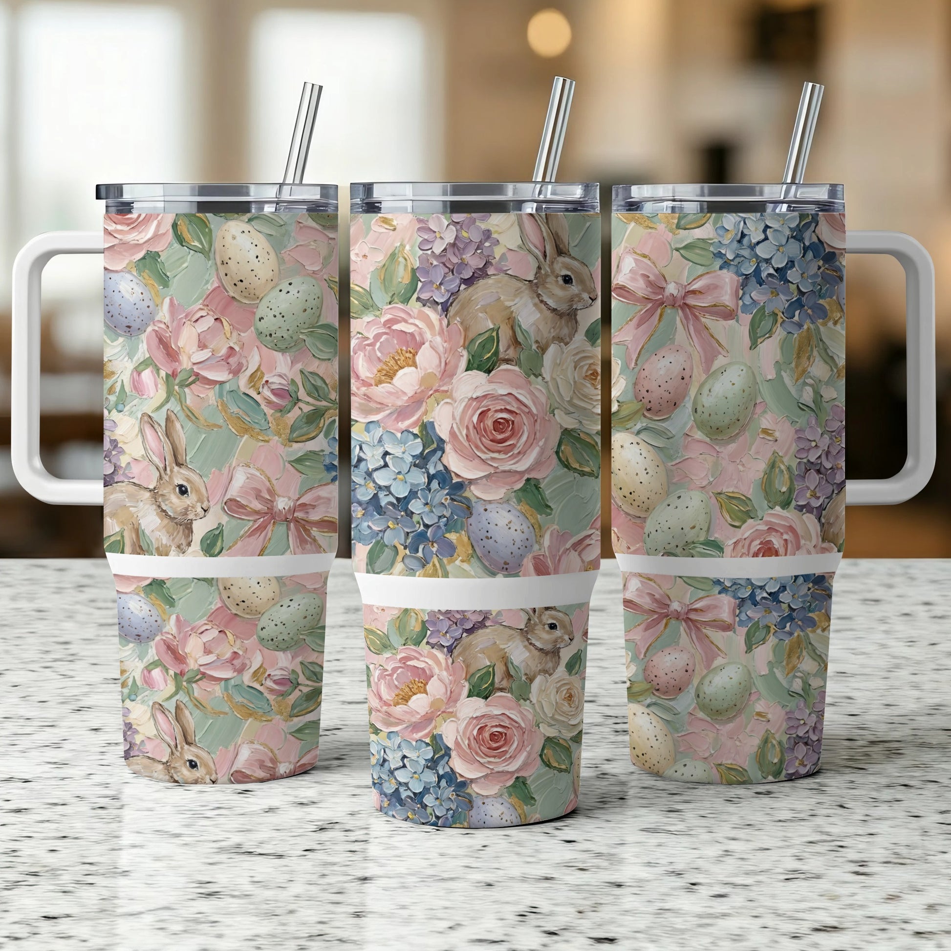 Three Easter-themed tumblers with bunnies, eggs, and floral patterns.