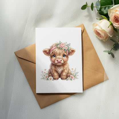 Fluffy Highland cow calf wearing a flower crown on a greeting card.