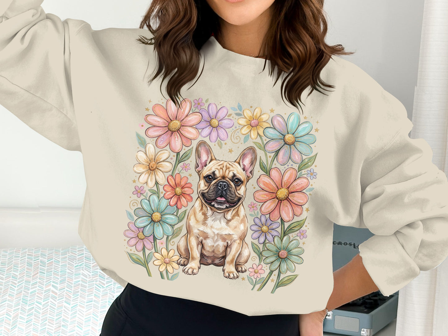 French bulldog surrounded by pastel floral illustration on crewneck sweatshirt.