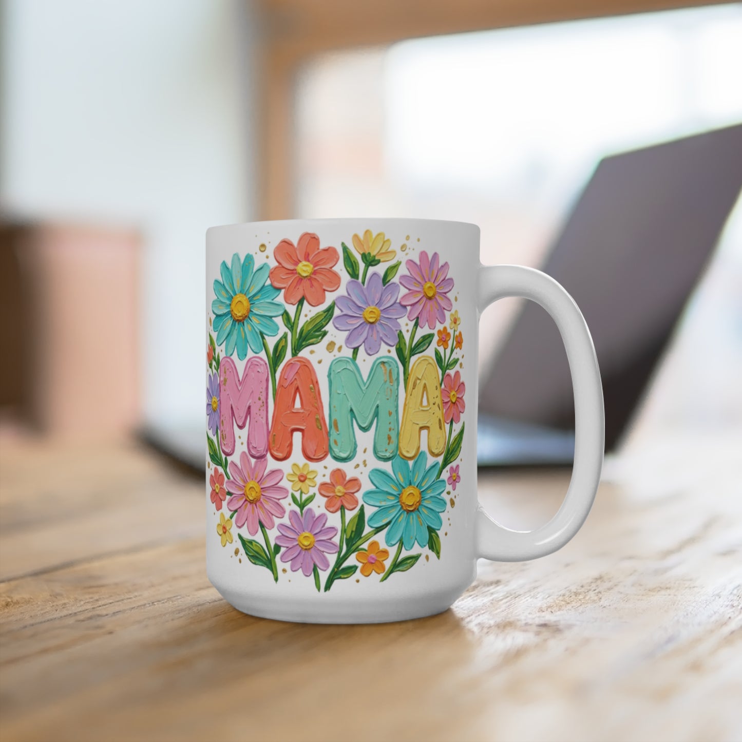 White mug with "MAMA" in colorful floral letters.