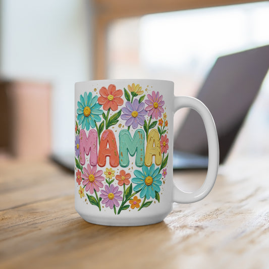 White mug with "MAMA" in colorful floral letters.