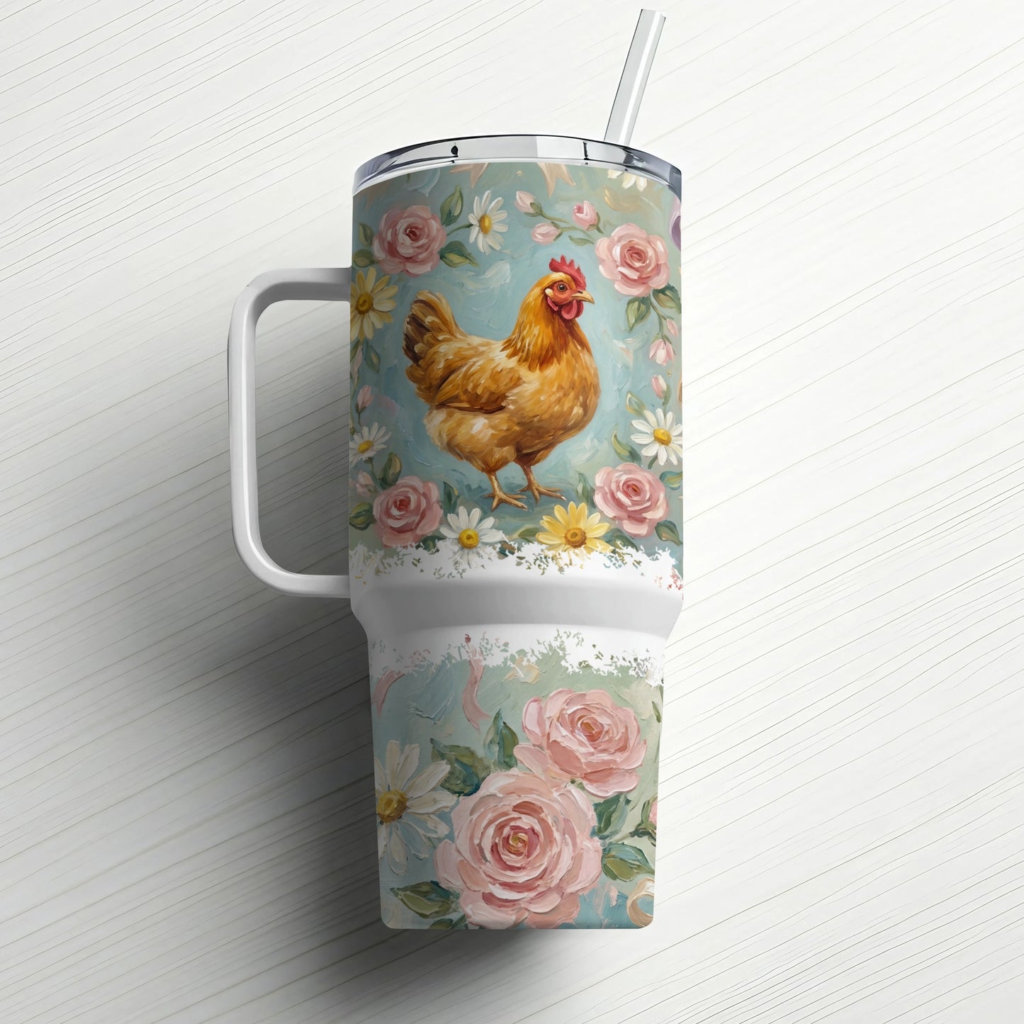 Brown chicken and pink roses on a floral patterned tumbler with a straw.