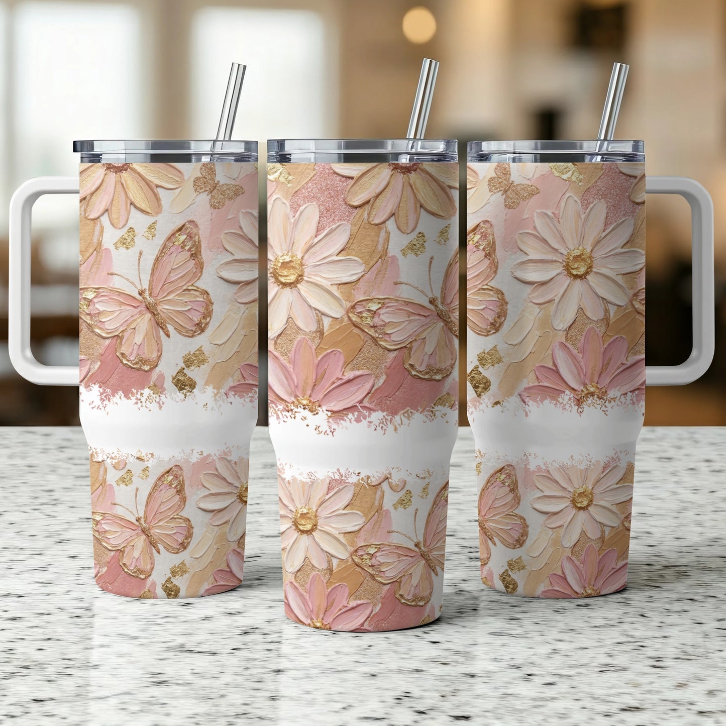 Three tumblers with butterfly and flower floral designs.