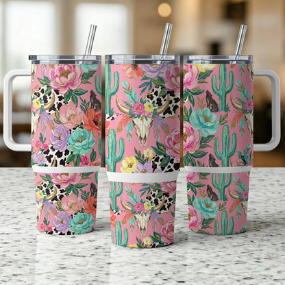 Three tumblers with floral, cactus, and cow print designs.