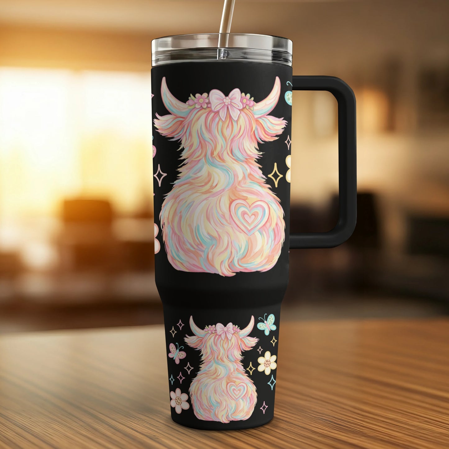 Black tumbler with fluffy pastel Highland cow, hearts, and butterflies design.