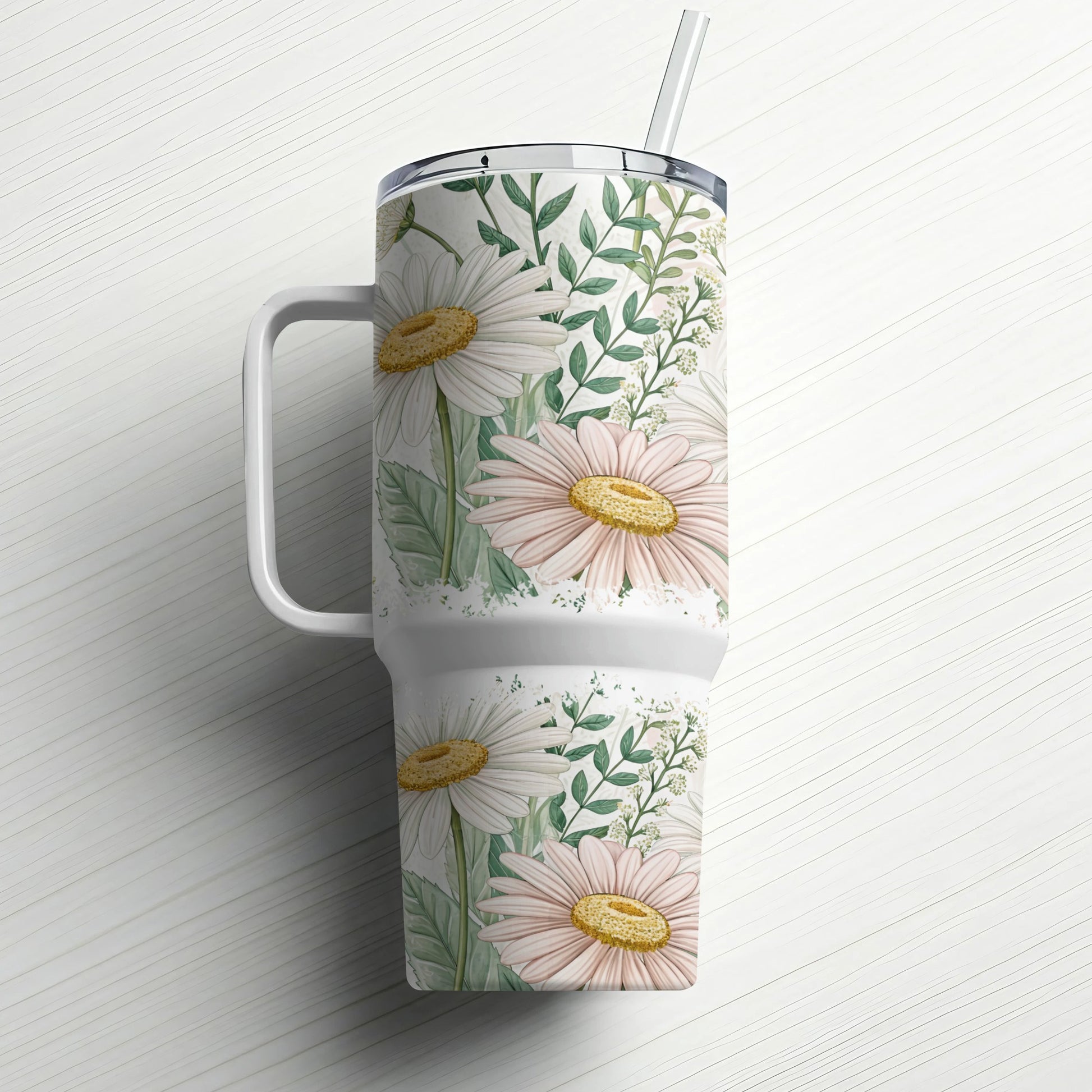Large insulated tumbler with handle featuring a floral daisy and greenery pattern.