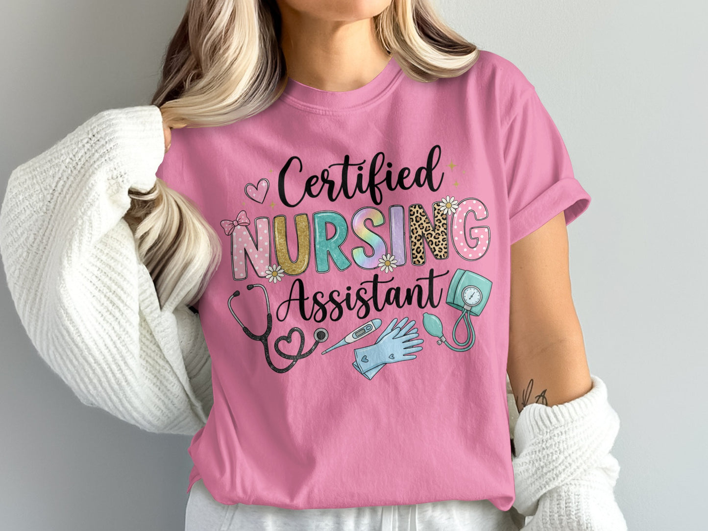 Pink t-shirt with "Certified Nursing Assistant" text and medical icons.