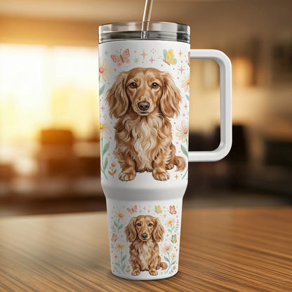 Dachshund dog illustration on a white travel tumbler with a handle.