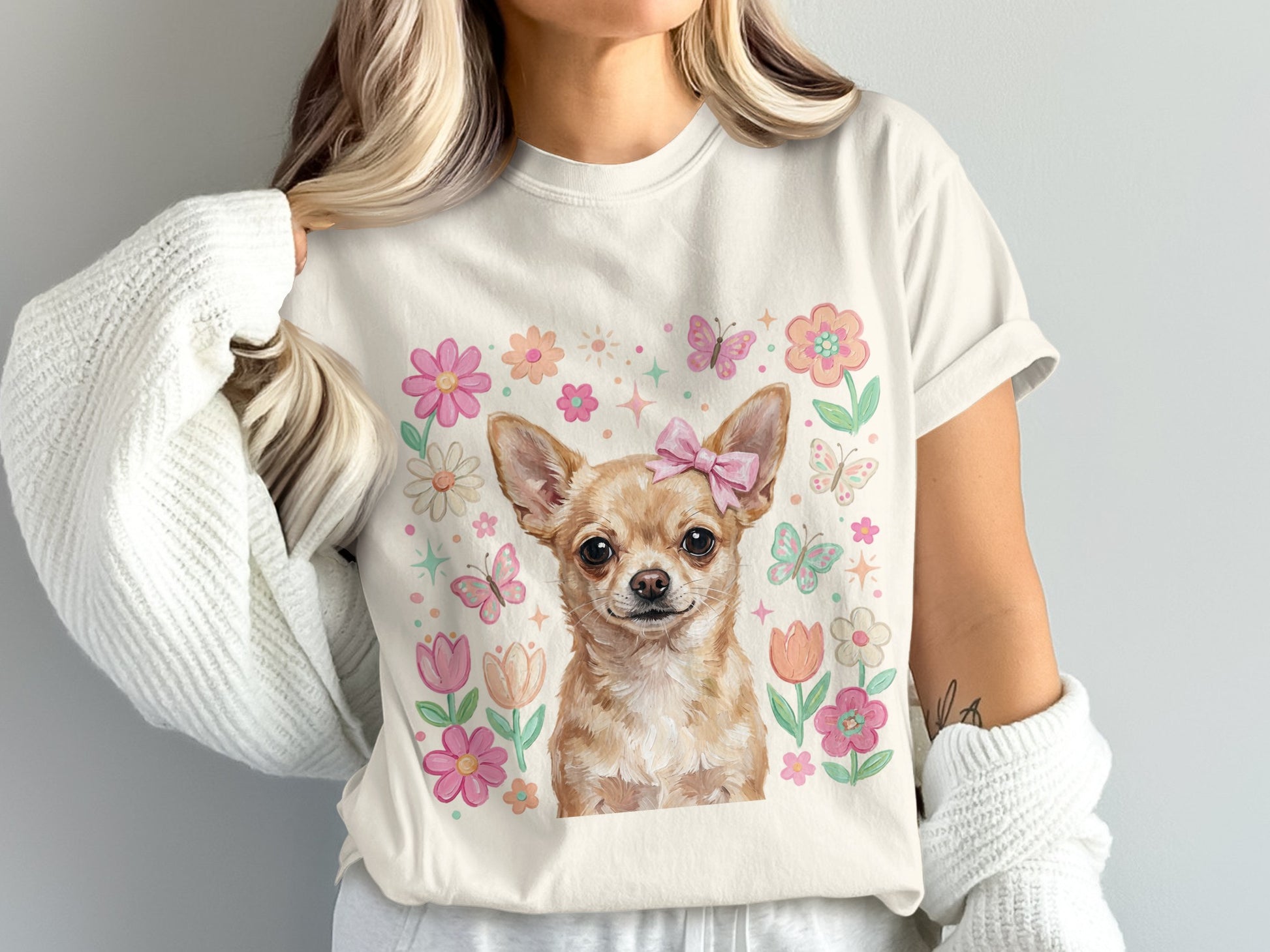 Chihuahua wearing pink bow with floral and butterfly border.