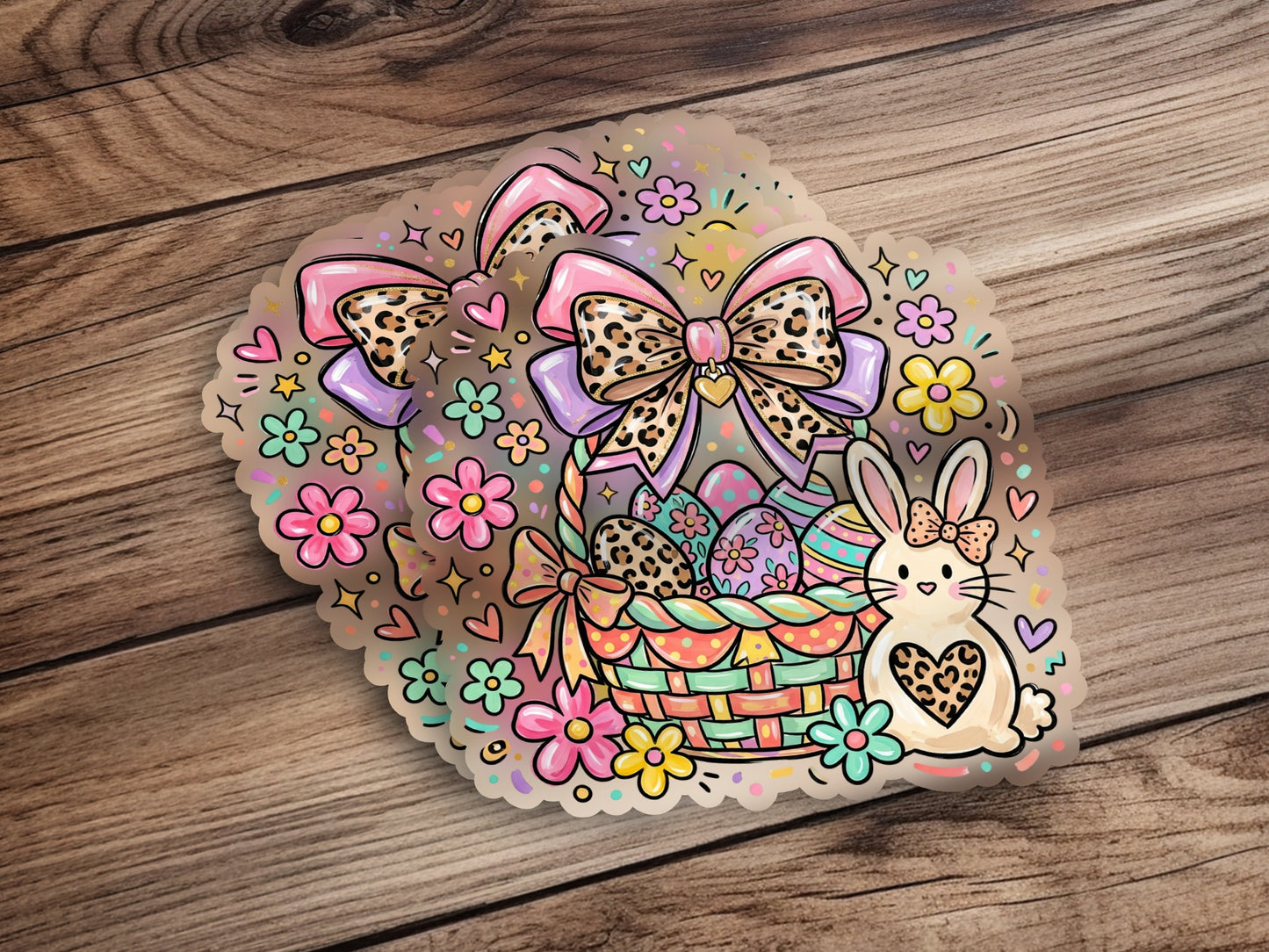 Easter basket with eggs, bunny, and bow stickers on a wooden surface.