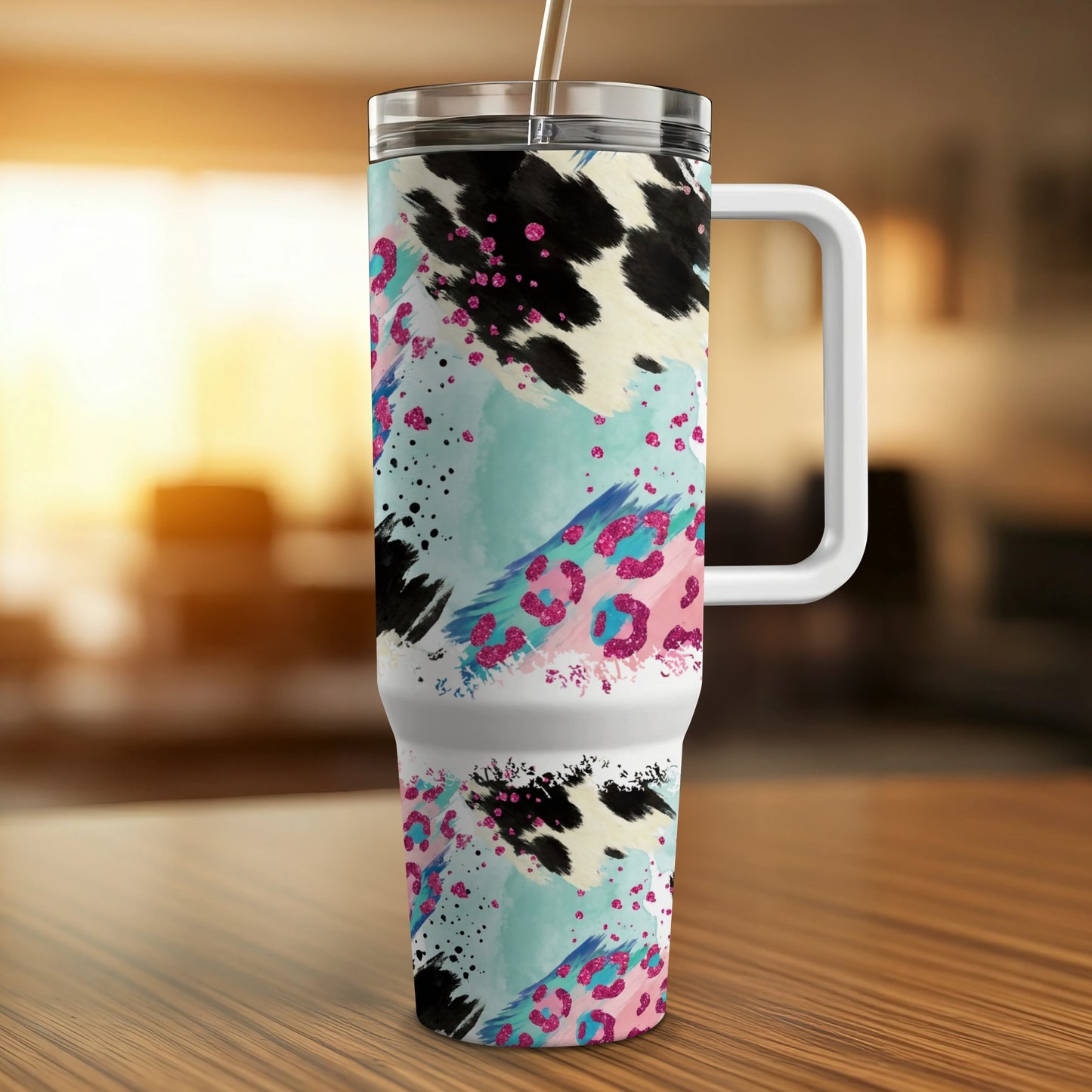 30 oz tumbler with cow print, leopard print, and teal paint splatter.