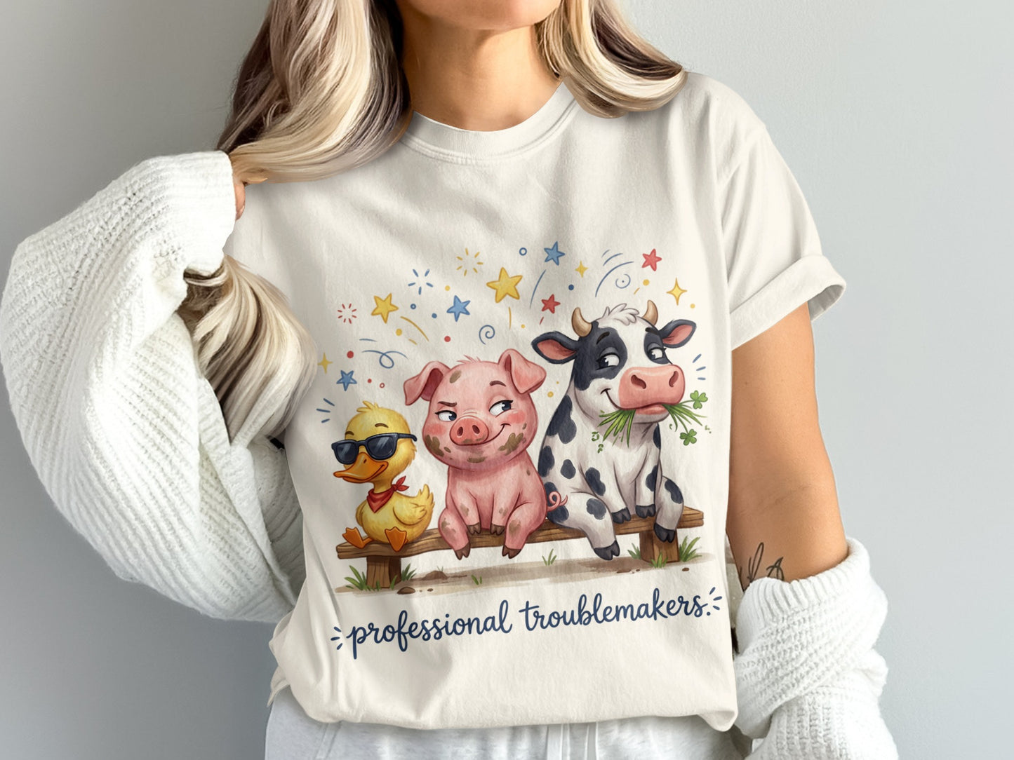 Pig, duck, and cow sitting on a bench with "professional troublemakers" text.
