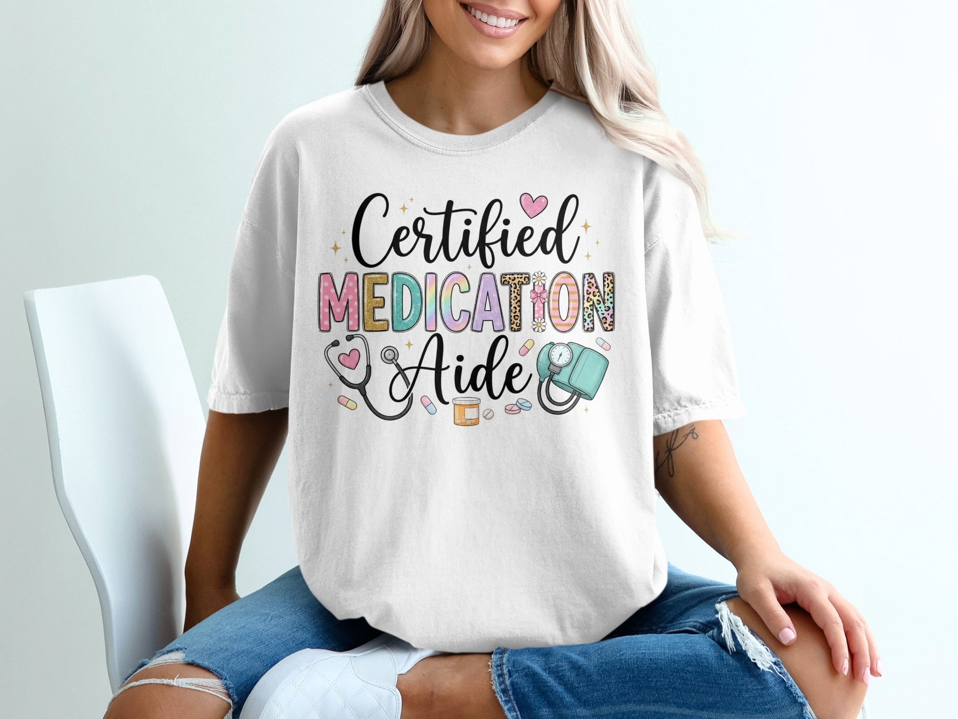 T-shirt with "Certified Medication Aide" text, stethoscope, and heart designs.