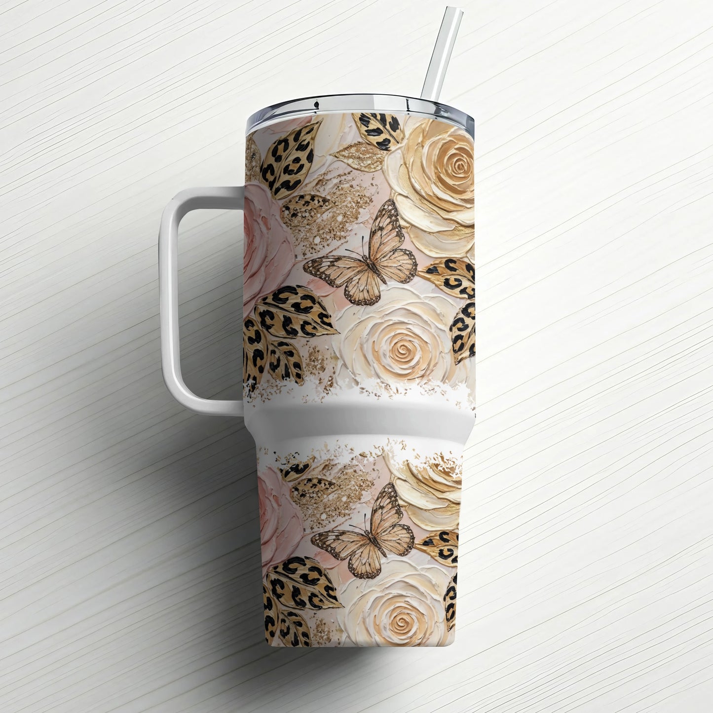 White tumbler with a floral and leopard print design and a straw.