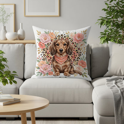 Dachshund wearing a bandana on a pillow with floral and leopard print.
