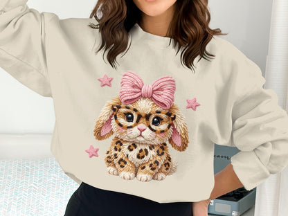 Cream sweatshirt with leopard print bunny wearing glasses and pink bow.