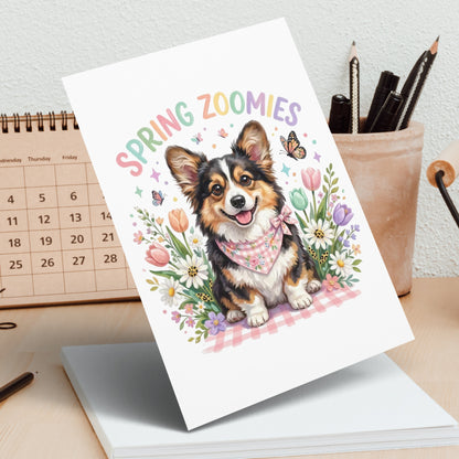 Corgi in a bandana with "Spring Zoomies" text and colorful flowers.