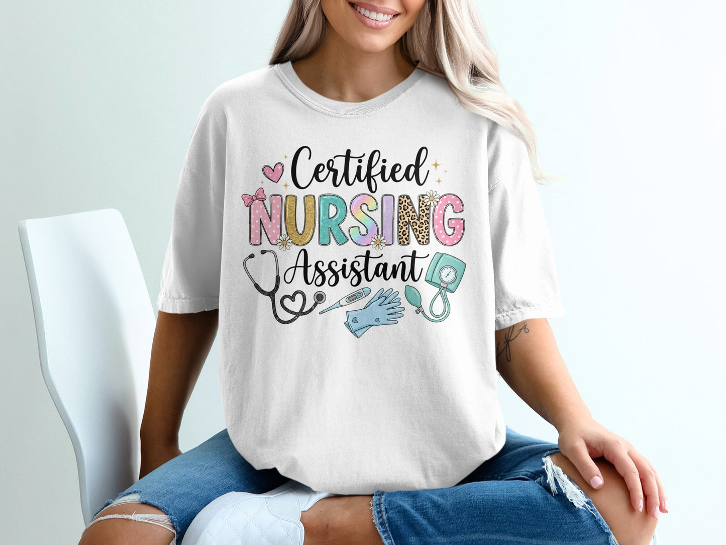 White t-shirt with "Certified Nursing Assistant" text and medical icons.