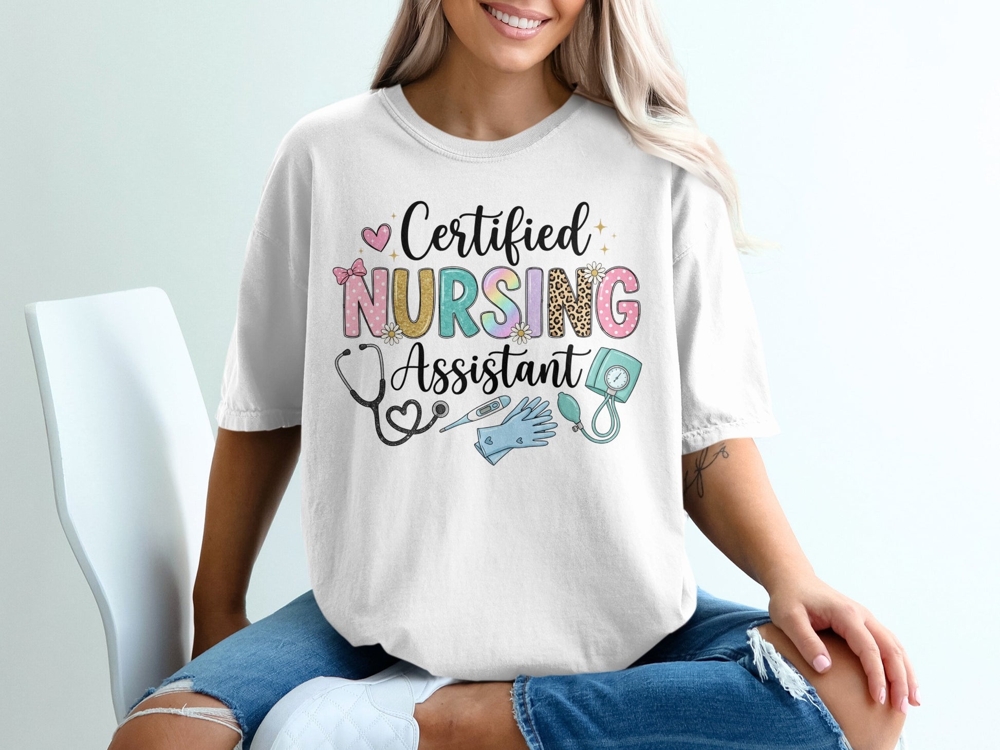White t-shirt with "Certified Nursing Assistant" text and medical icons.