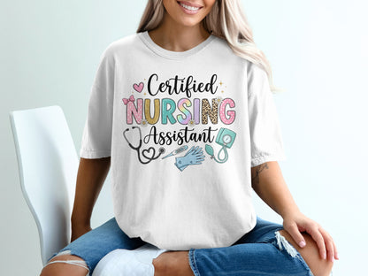 White t-shirt with "Certified Nursing Assistant" text and medical icons.