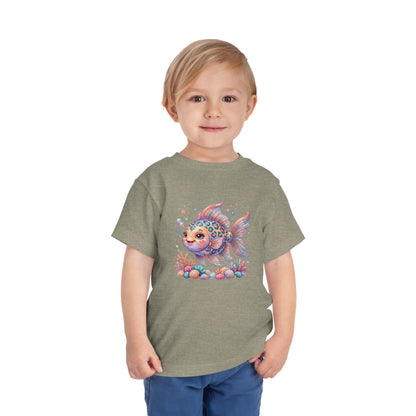 Child wearing a gray t-shirt with a colorful cartoon fish design.
