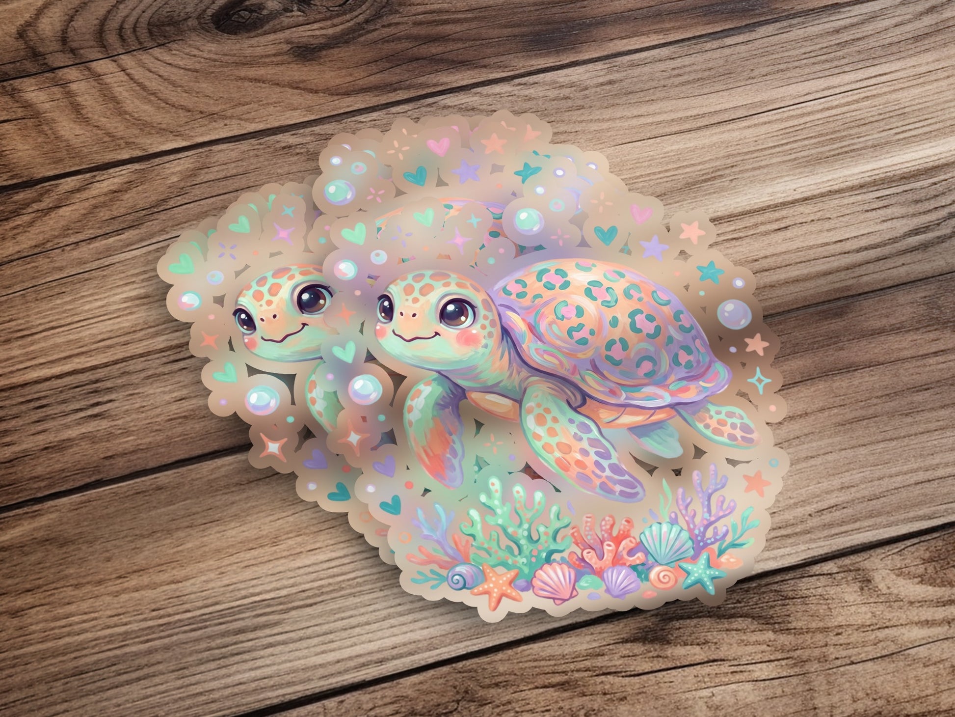 Two cartoon sea turtles with coral and starfish, holographic sticker.