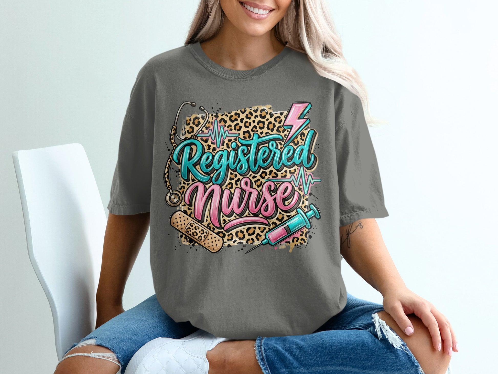 Gray t-shirt with "Registered Nurse" text, stethoscope, lightning, and syringe graphic.