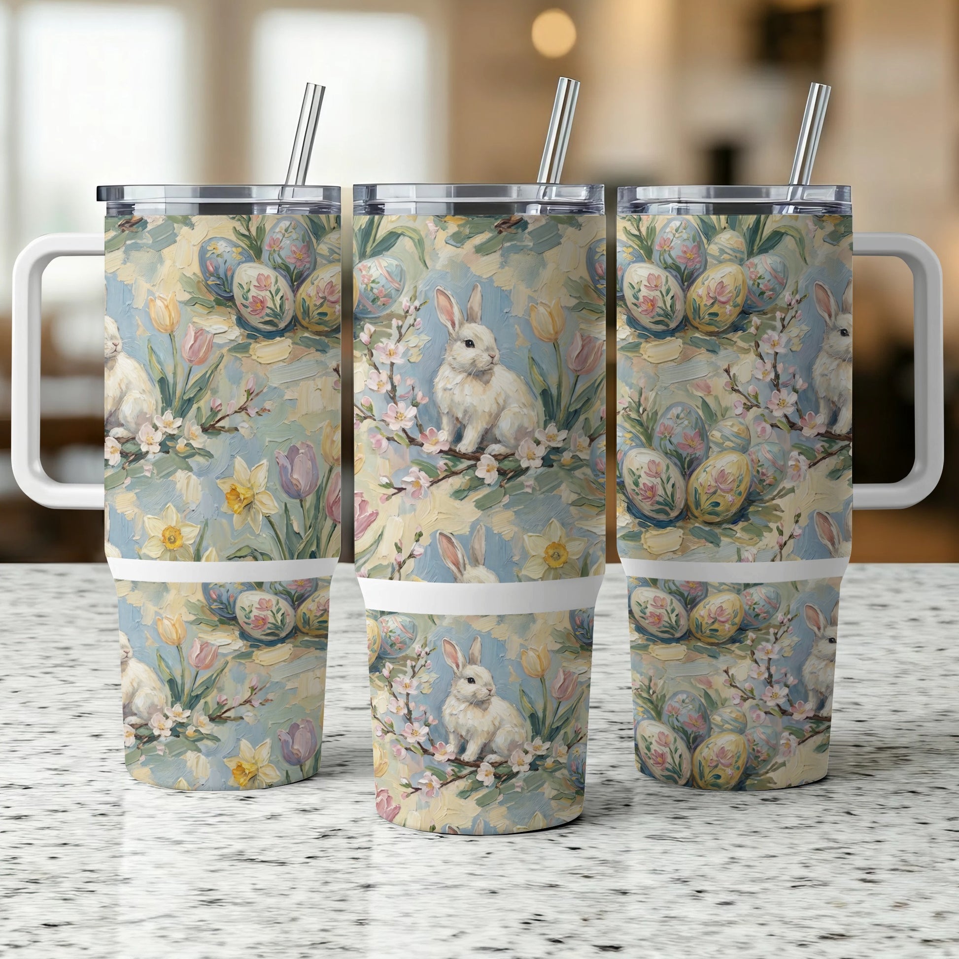 Easter bunny and floral design on three stainless steel tumblers.