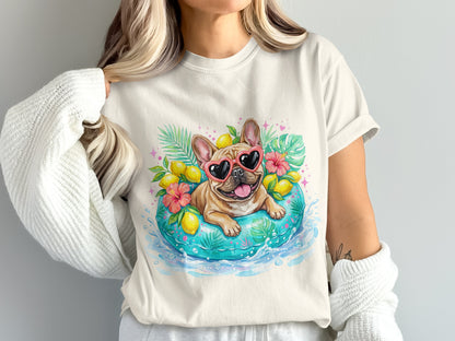 French bulldog wearing heart sunglasses on an inner tube with lemons and tropical leaves.