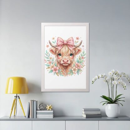 Watercolor Highland cow with pink bow and floral wreath in a white frame.