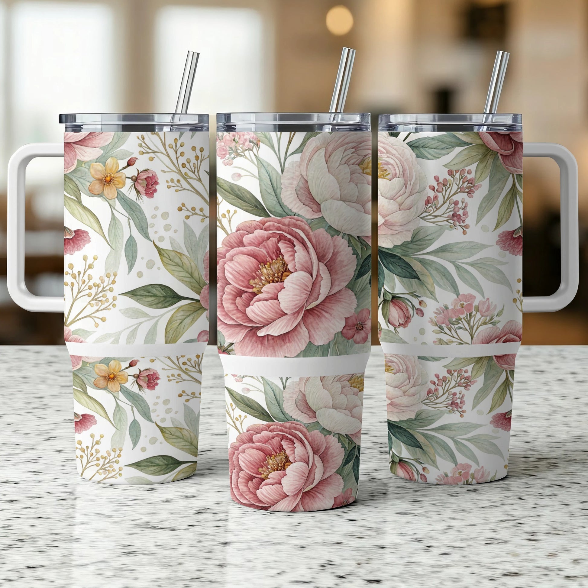 Three tumblers with a pink floral and green leaf pattern.