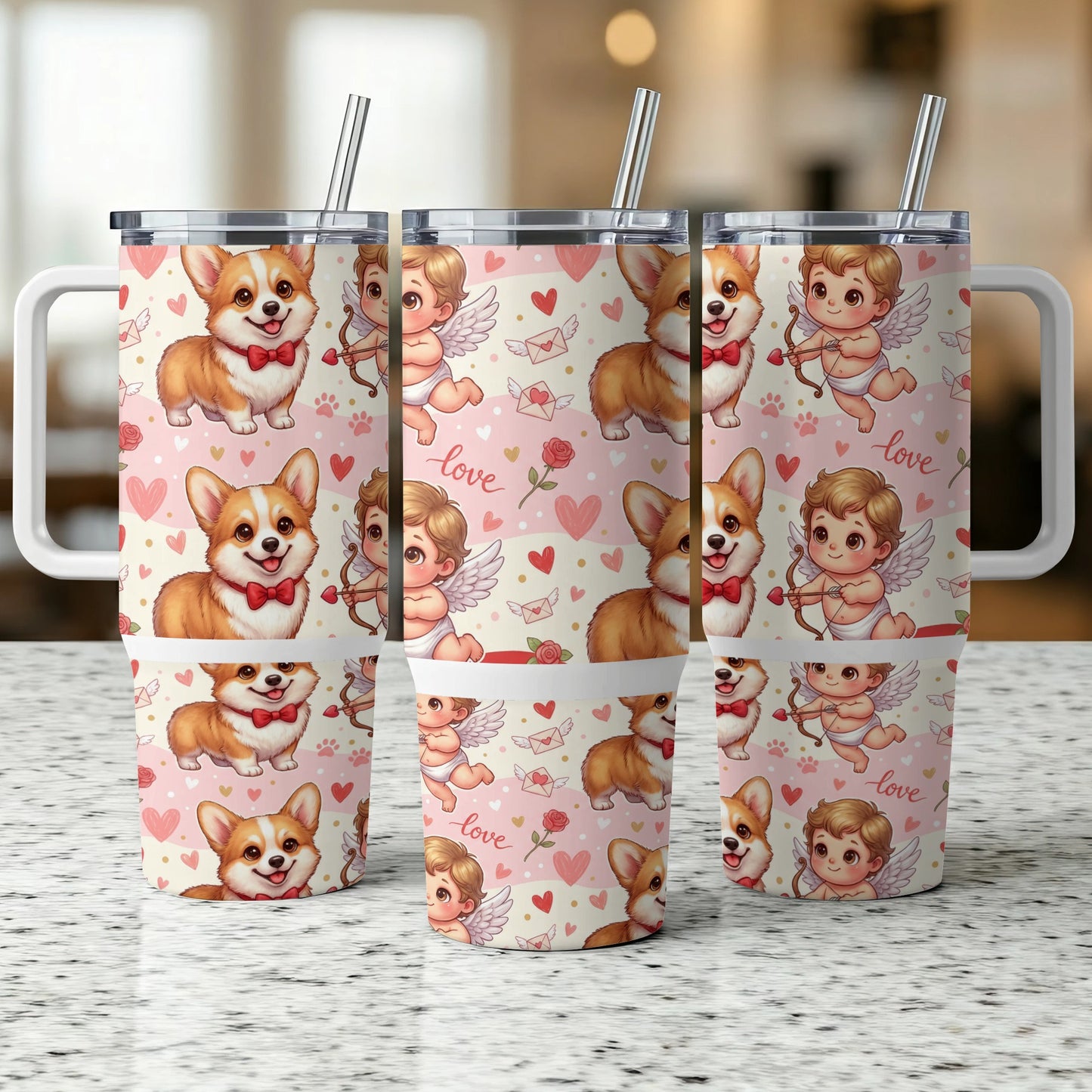 Three corgi dog and cupid tumbler cups with straws on a counter.