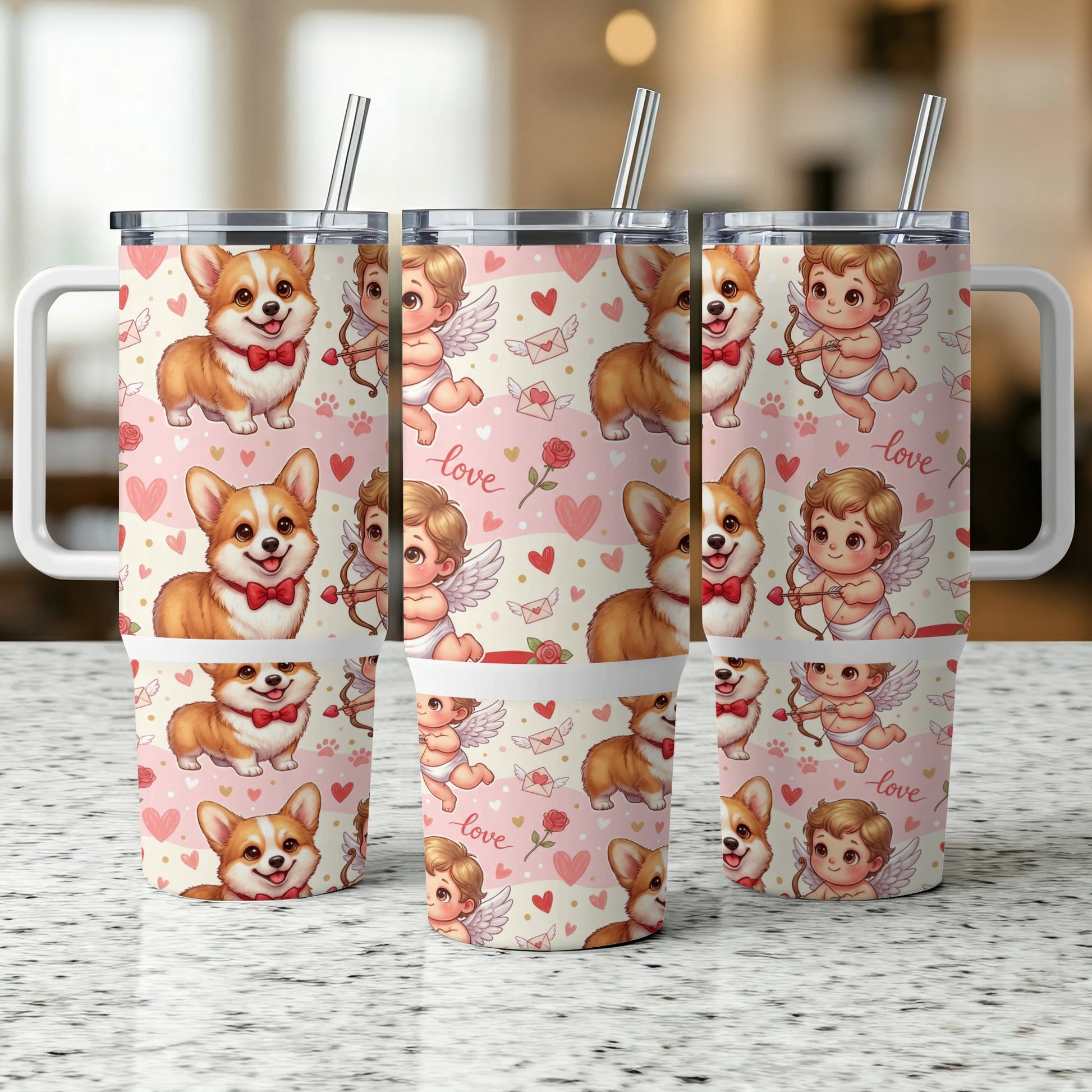 Three corgi dog and cupid tumbler cups with straws on a counter.