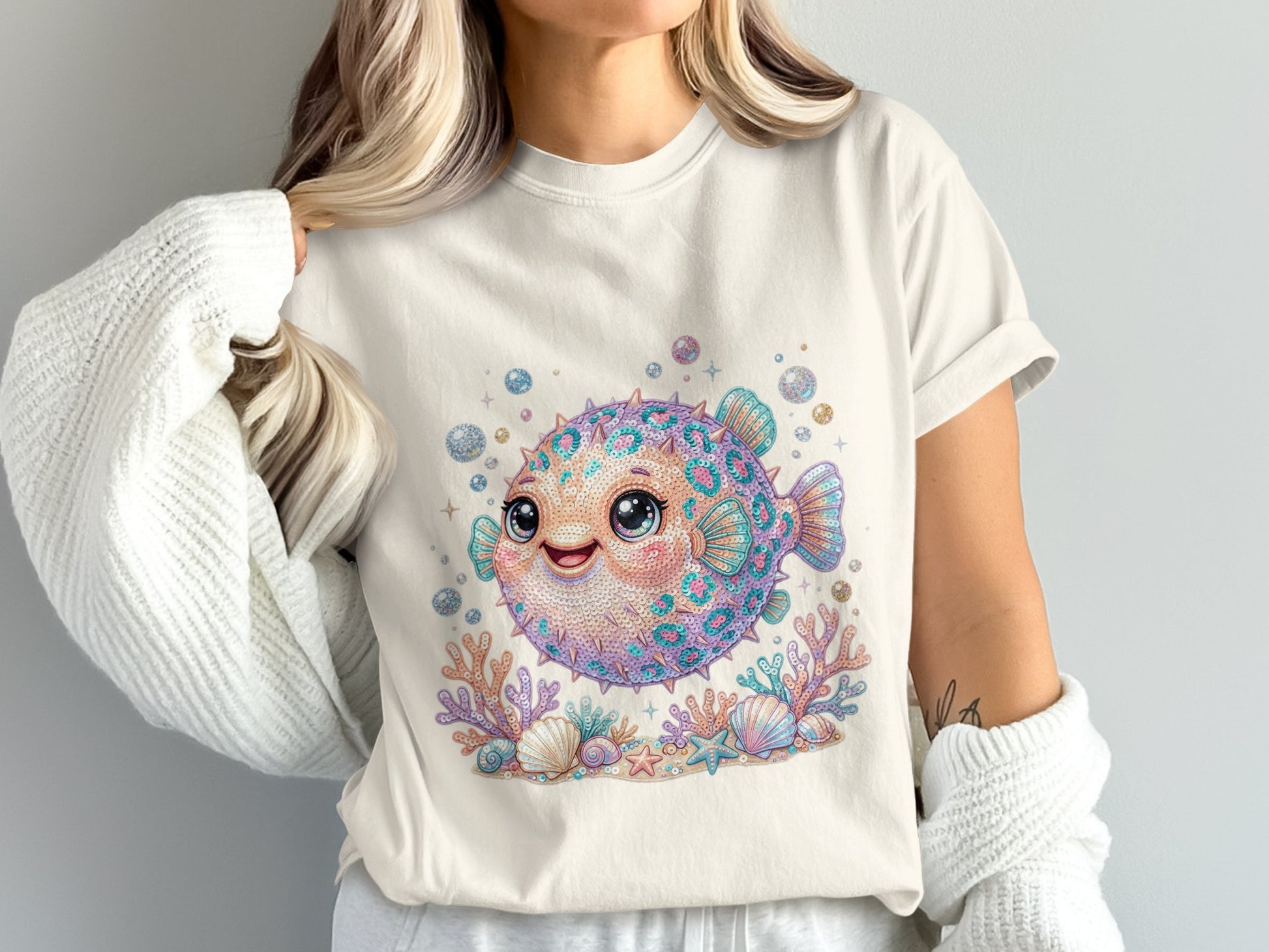 Whimsical pufferfish illustration with coral, seashells, and bubbles.