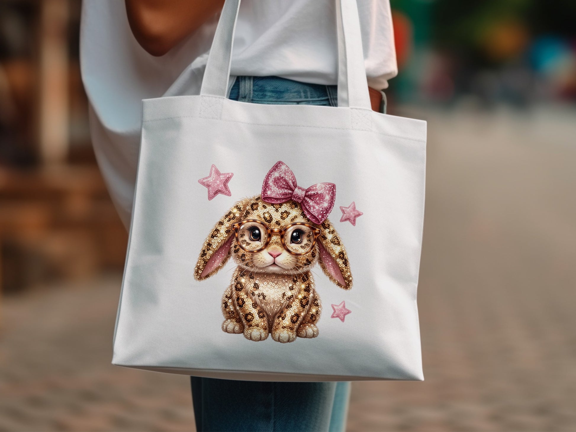 White tote bag with a leopard-print bunny wearing glasses and a pink bow.