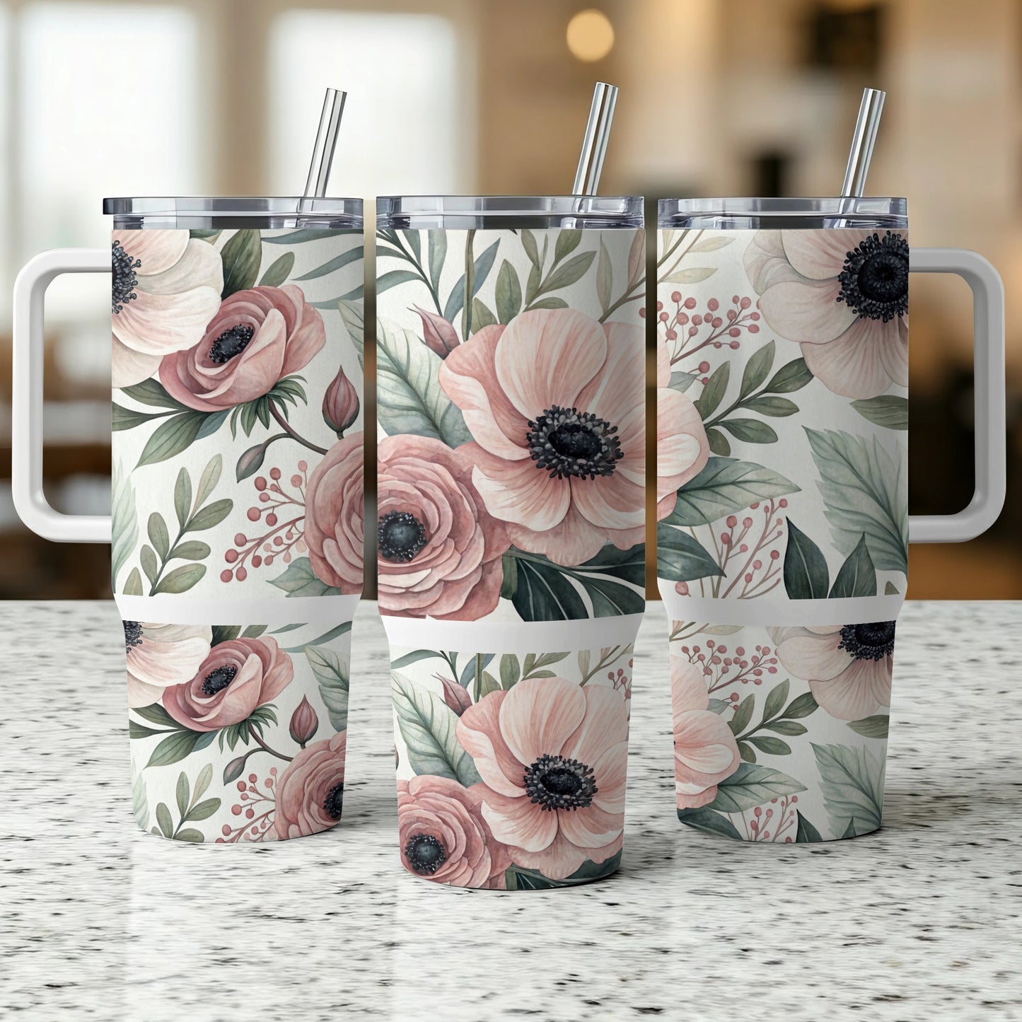 Three floral tumblers with pink anemones and green leaves on a speckled surface.