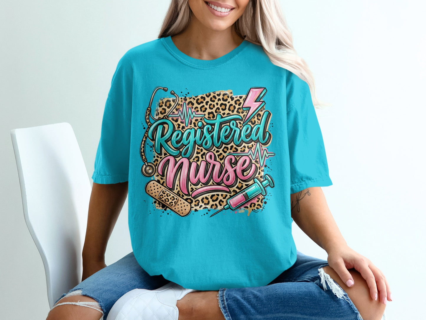 Turquoise t-shirt with "Registered Nurse" text and medical graphics.