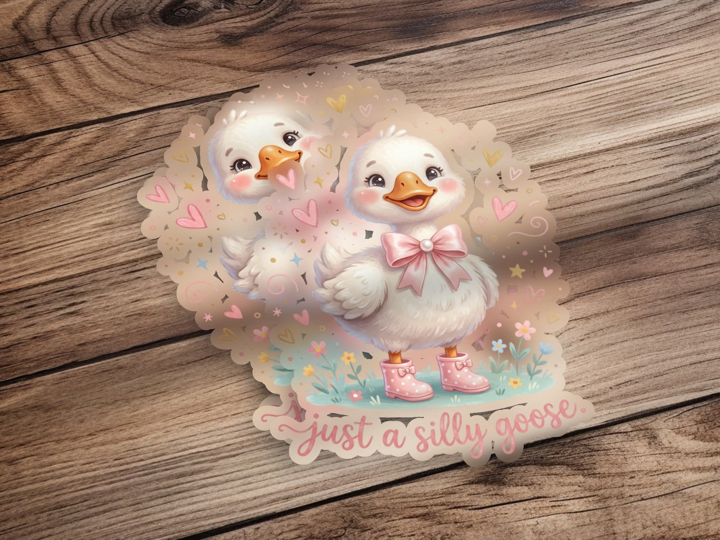 Two cute cartoon geese with pink boots and a bow, text says "just a silly goose."