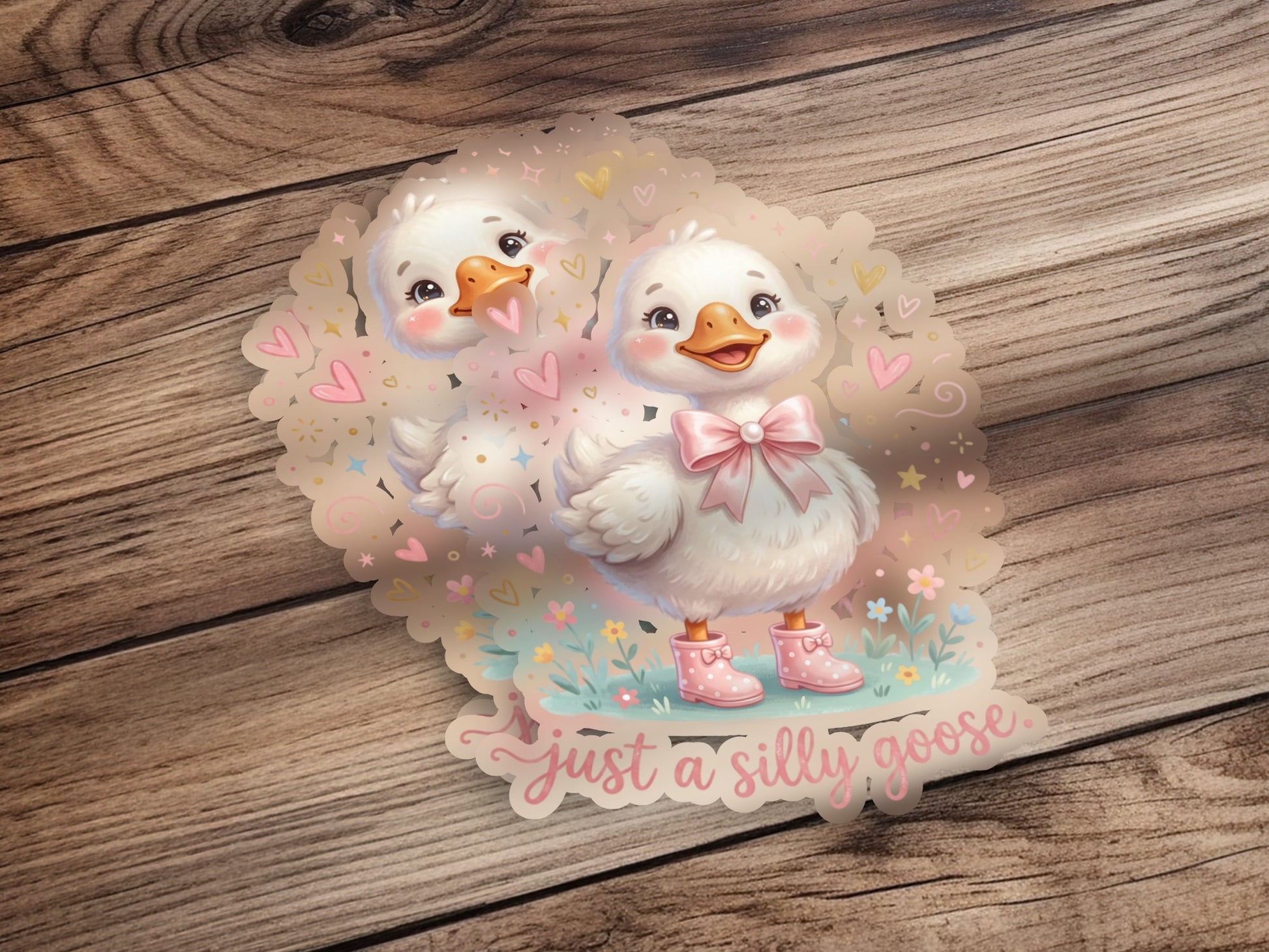 Two cute cartoon geese with pink boots and a bow, text says "just a silly goose."