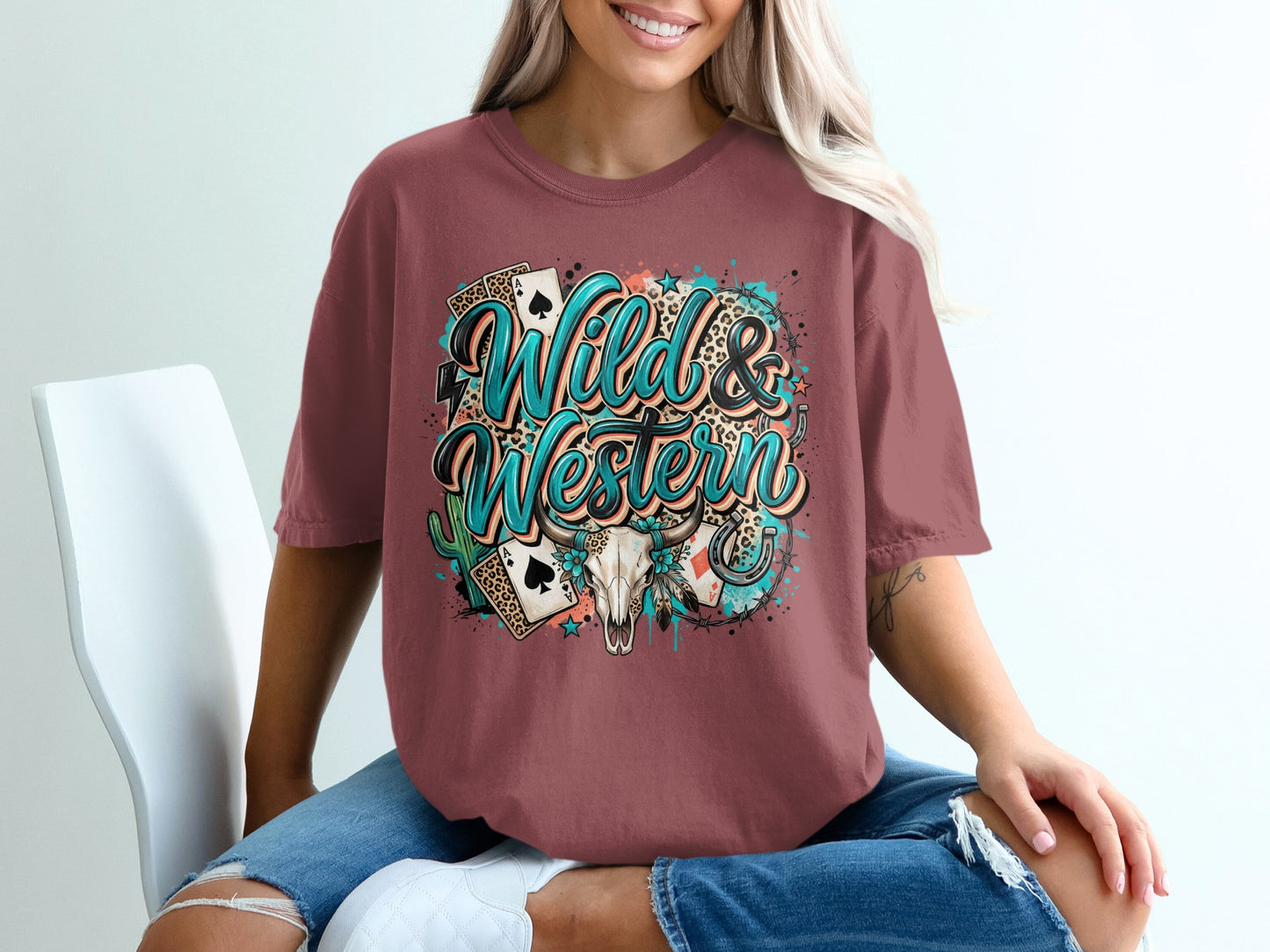 T-shirt with "Wild & Western" text, horseshoe, cactus, and playing cards graphic.