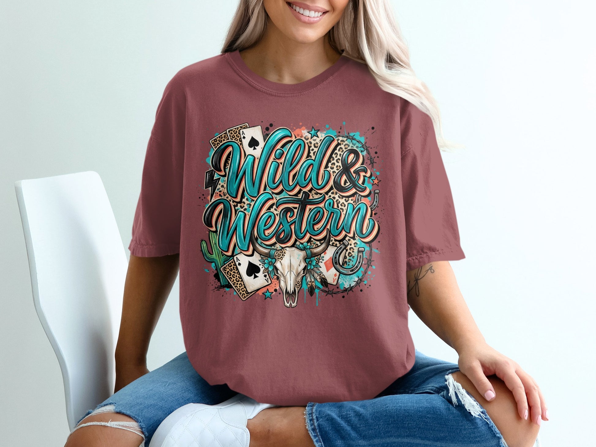 T-shirt with "Wild & Western" text, horseshoe, cactus, and playing cards graphic.