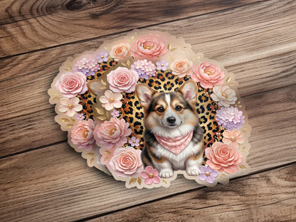 Corgi wearing a bandana surrounded by pink flowers and leopard print.